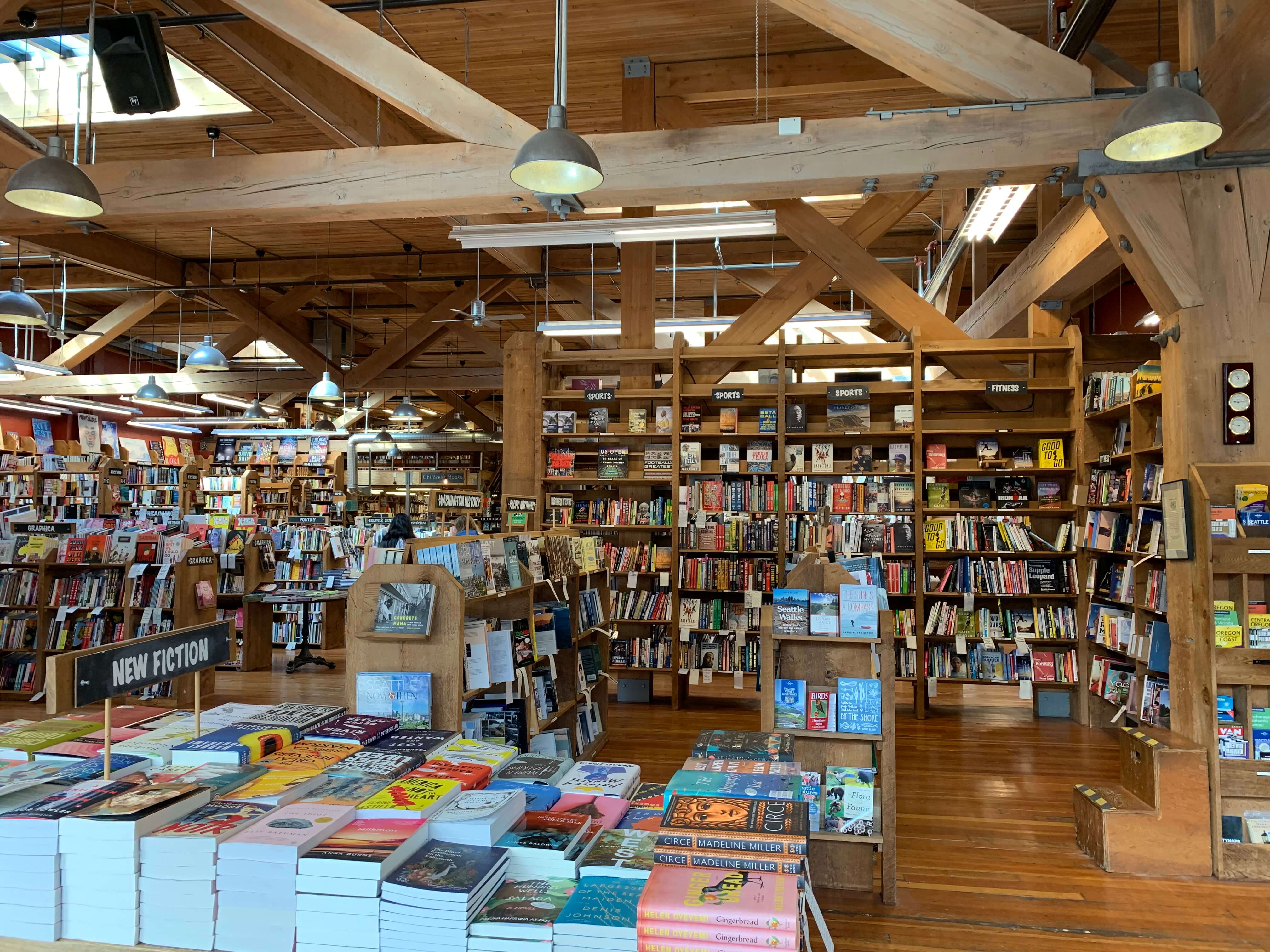 Cozy bookstore, shelves brimming with books under the warm library