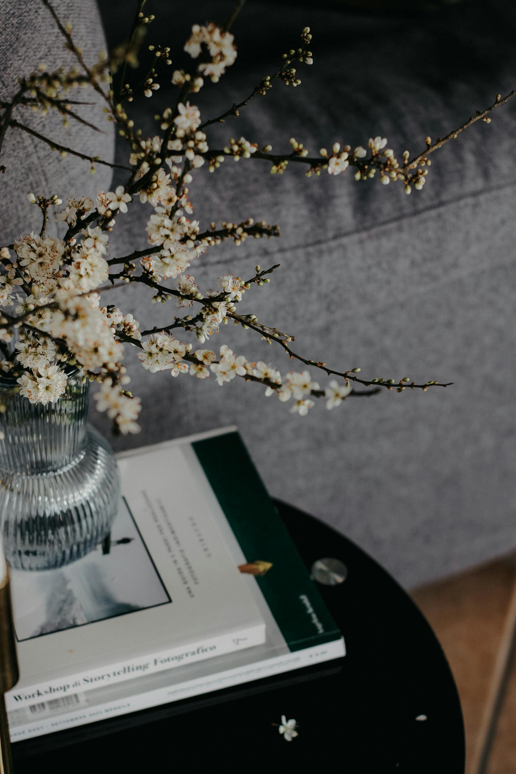 Home refresh with beautiful branches adorned with blossoms complement a modern living room decor.